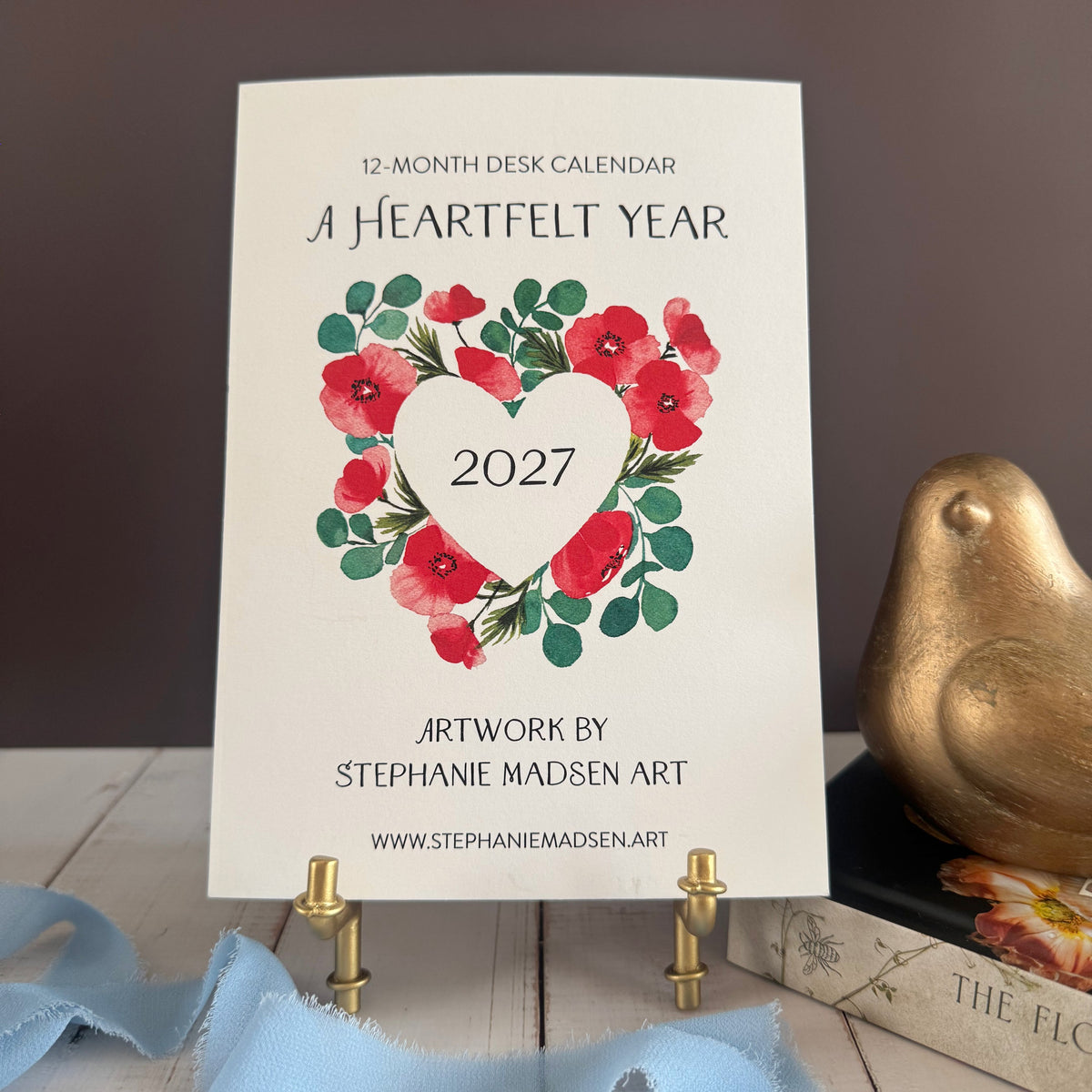 A Heartfelt Year 2027 desk calendar, red poppy heart wreath on a gold easel