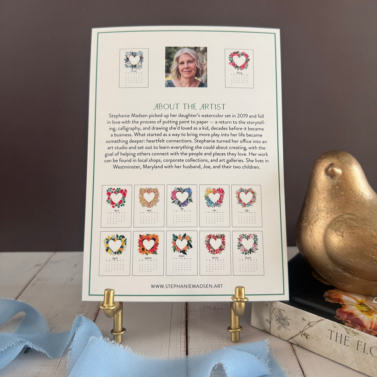 Back of the heart wreath desk calendar showing all twelve wreaths and a note about the artist